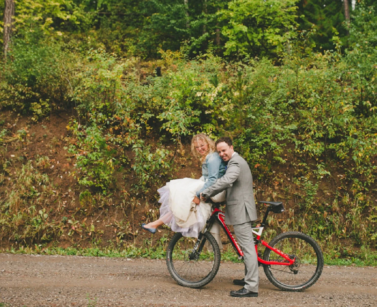 Suzy and Trevor on a mountain bike together.