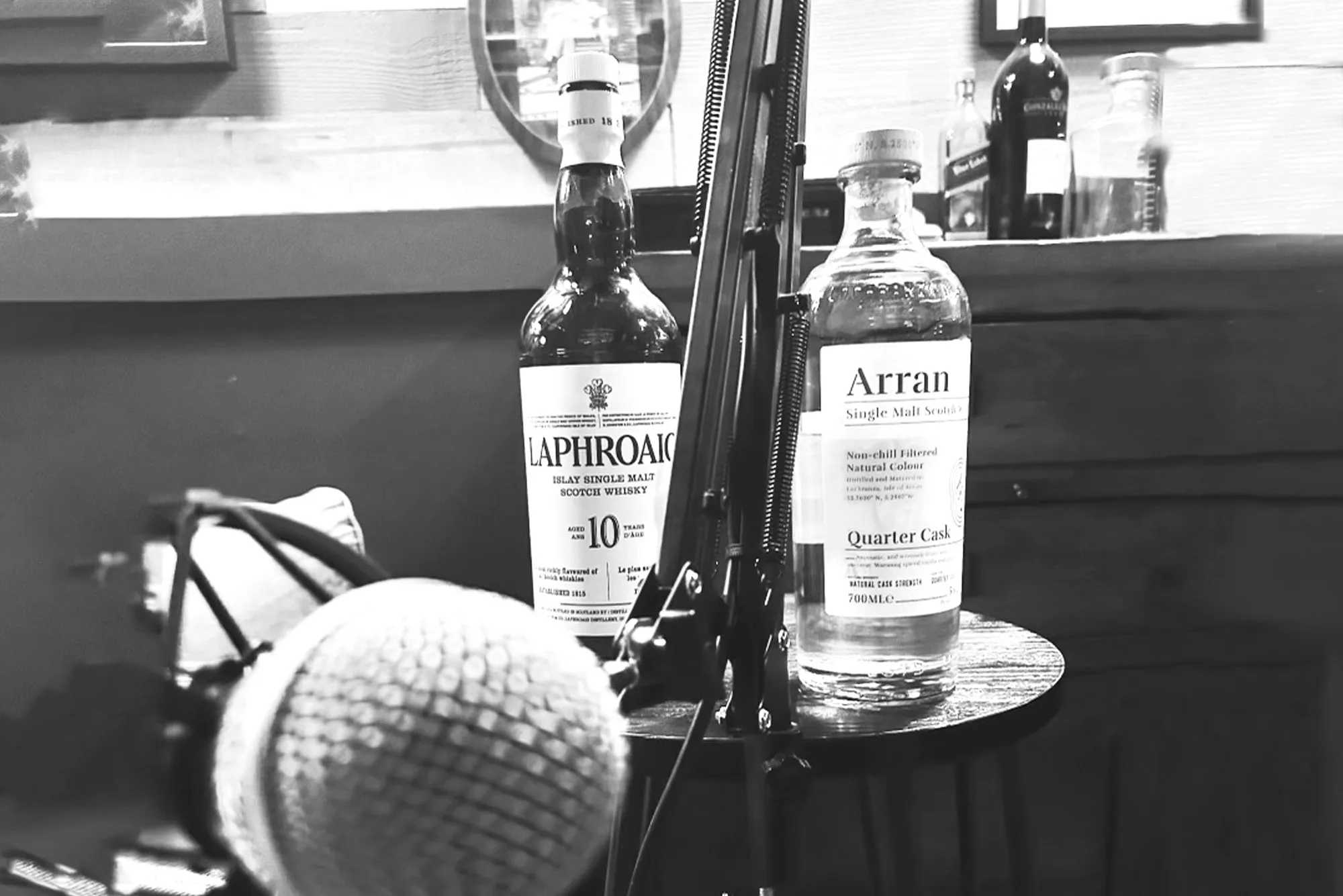 Welcome to the Dram Adventure Podcast, this is a picture of a microphone in from of tow bottles of whisky